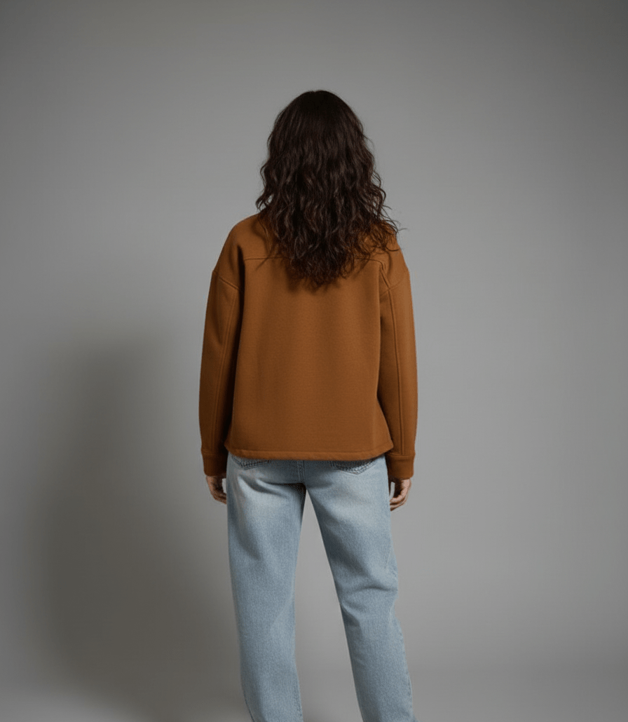 oversized jacket in a warm caramel-brown color. Features a relaxed, simple silhouette made from a thick, cozy fabric. - Small