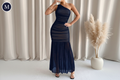 Dress with M badge top-left