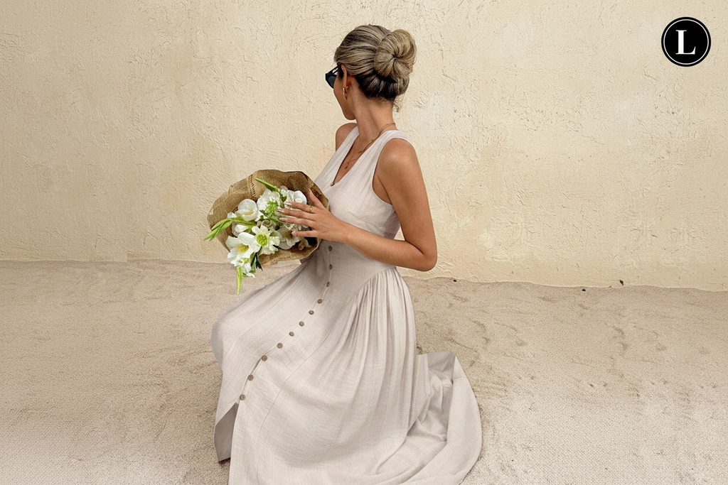 Linen midi dress - seated pose with flowers - L badge