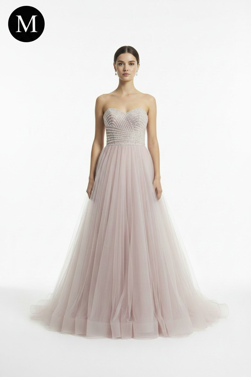 Front view - blush pink ball gown with M badge
