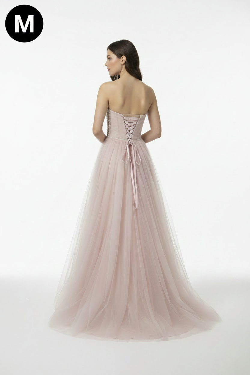 Back view - blush pink ball gown with M badge